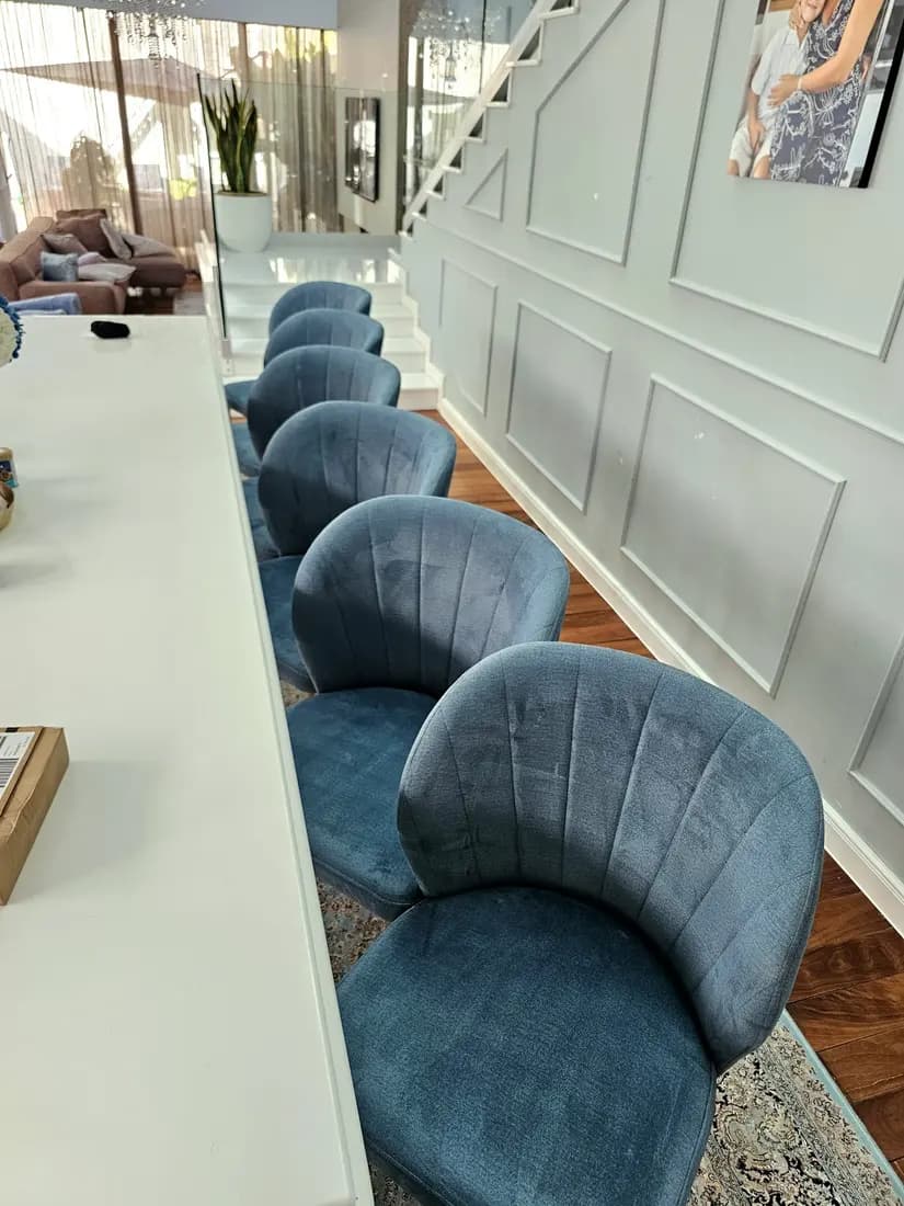 Blue velvet dining chairs cleaned by ARA Clean Malta in a Malta villa