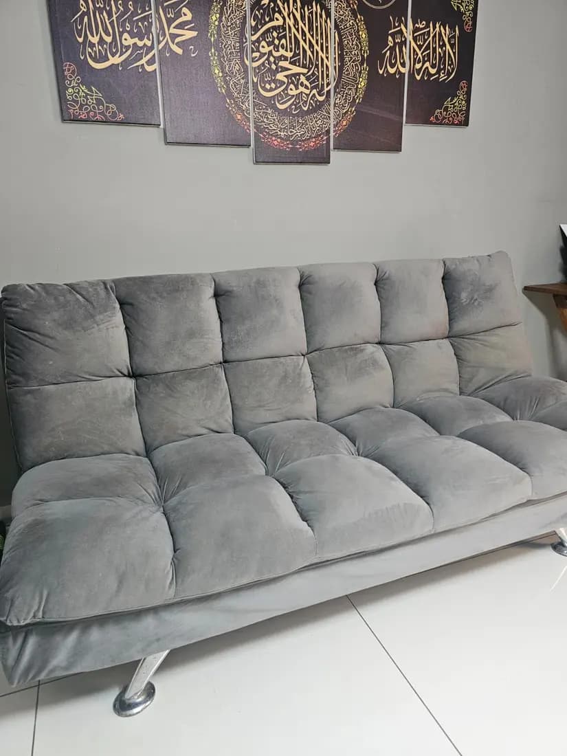 grey velvet sofa bed before cleaning by ARA Clean Malta