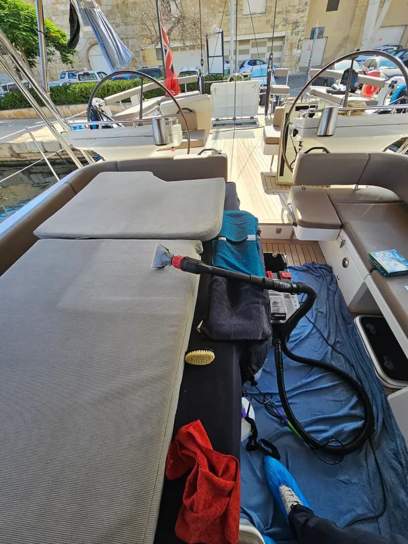 Yacht cushion being cleaned on board by ARA Clean Malta